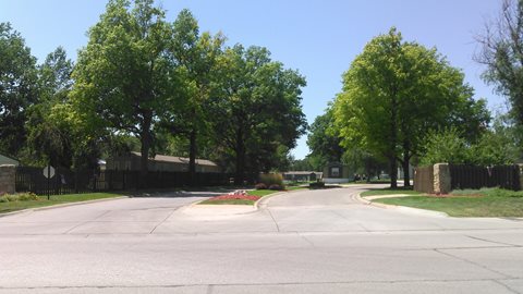 Street with a sidewalk and a fence. at Maple Grove, Nebraska, 68521